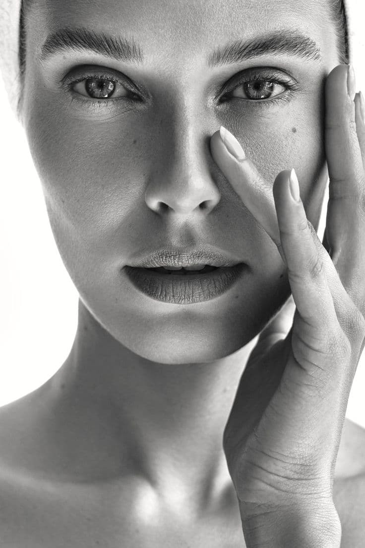 Editorial close-up of skin in soft natural light
